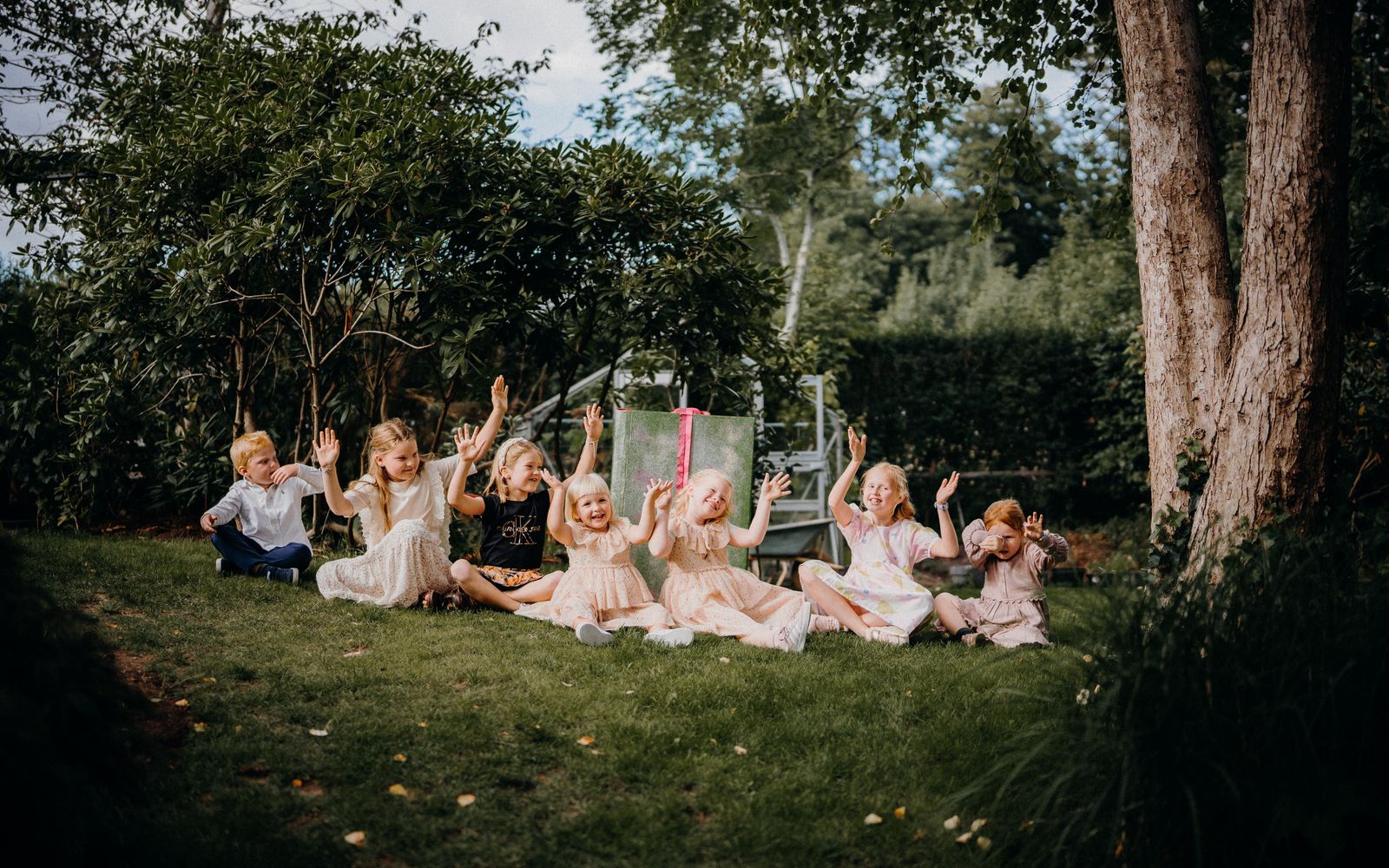 Children playing on a green lawn